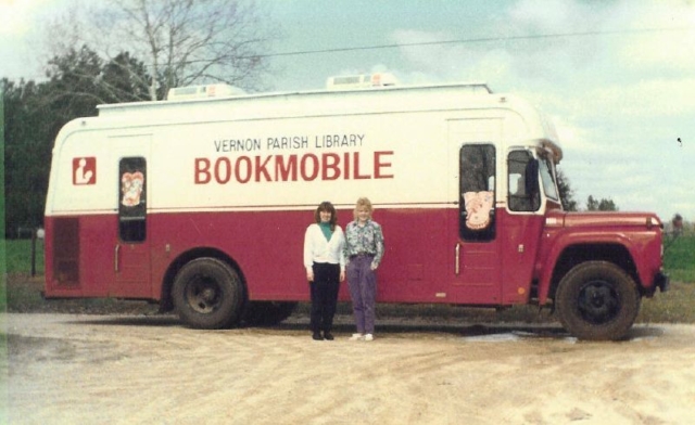 The original Vernon Parish Library bookmobile, retired in 1995. Claire Lacombe and Tammy Tilghman in front of old bookmobile